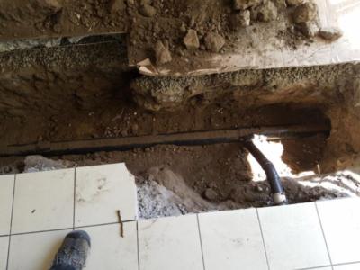 Sewer work inside house under slab.